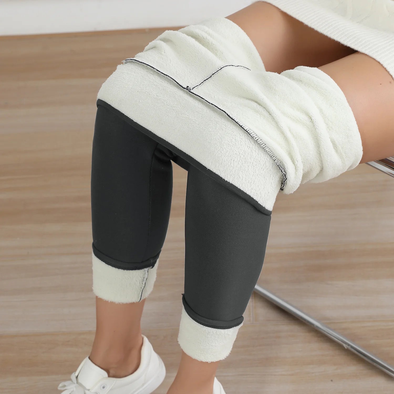 Warm fleece leggings for women worn comfortably over a sweater, showcasing soft and stylish design.