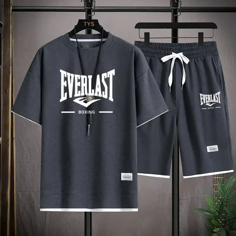 Everlast T-Shirts for comfort and style featuring a dark gray outfit with shorts and short-sleeve shirt.