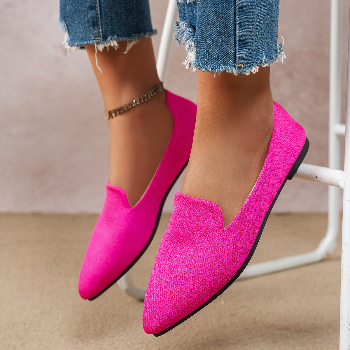 Women's flat pointed-toe shoes in vibrant pink, perfect for casual everyday wear.