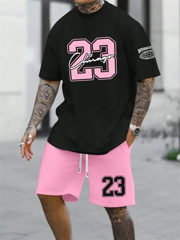 Stylish man wearing a digital shirt and shorts combo featuring black shirt and pink shorts with graphic designs.