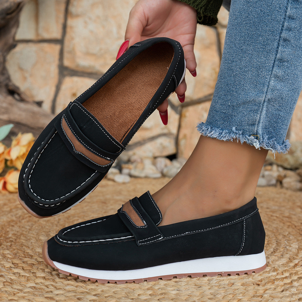 Close-up of stylish women's platform casual shoes in black, showcasing chic design and comfort features.