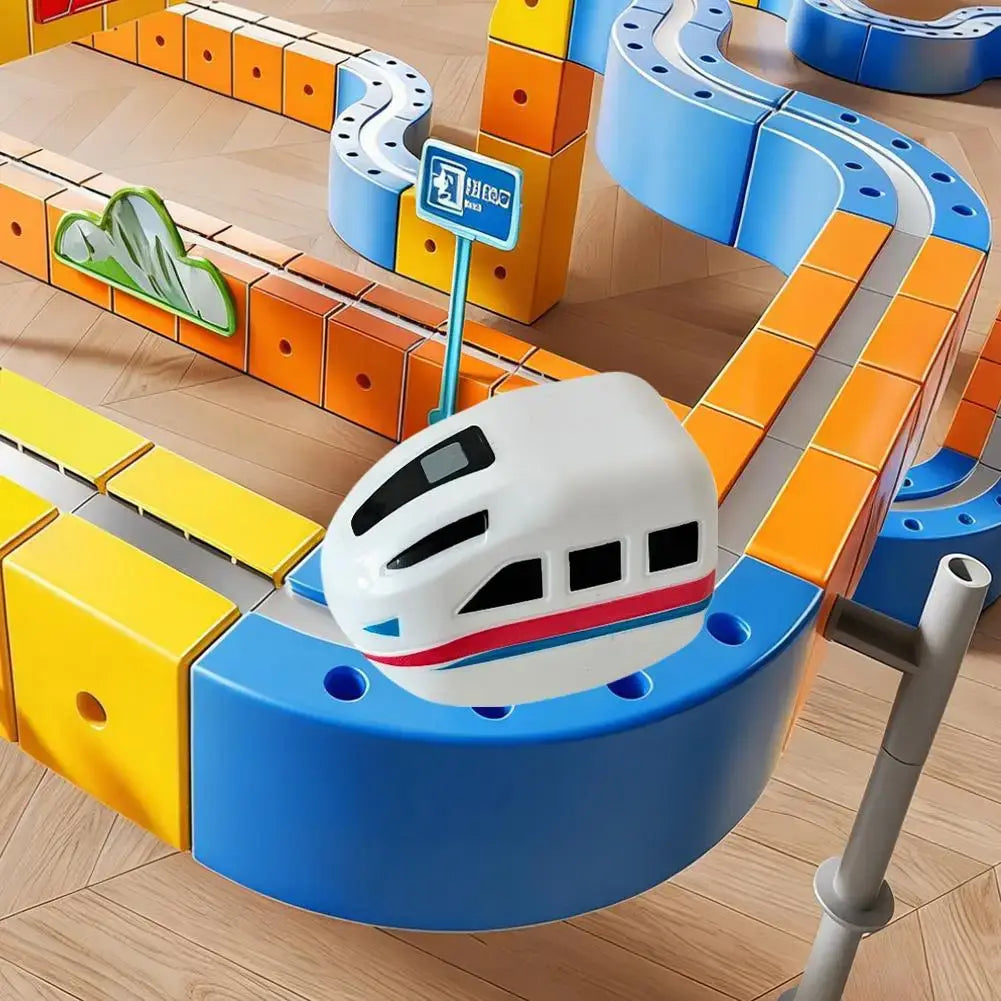 Magnetic rail car toys system with colorful tracks and a white electric train car.