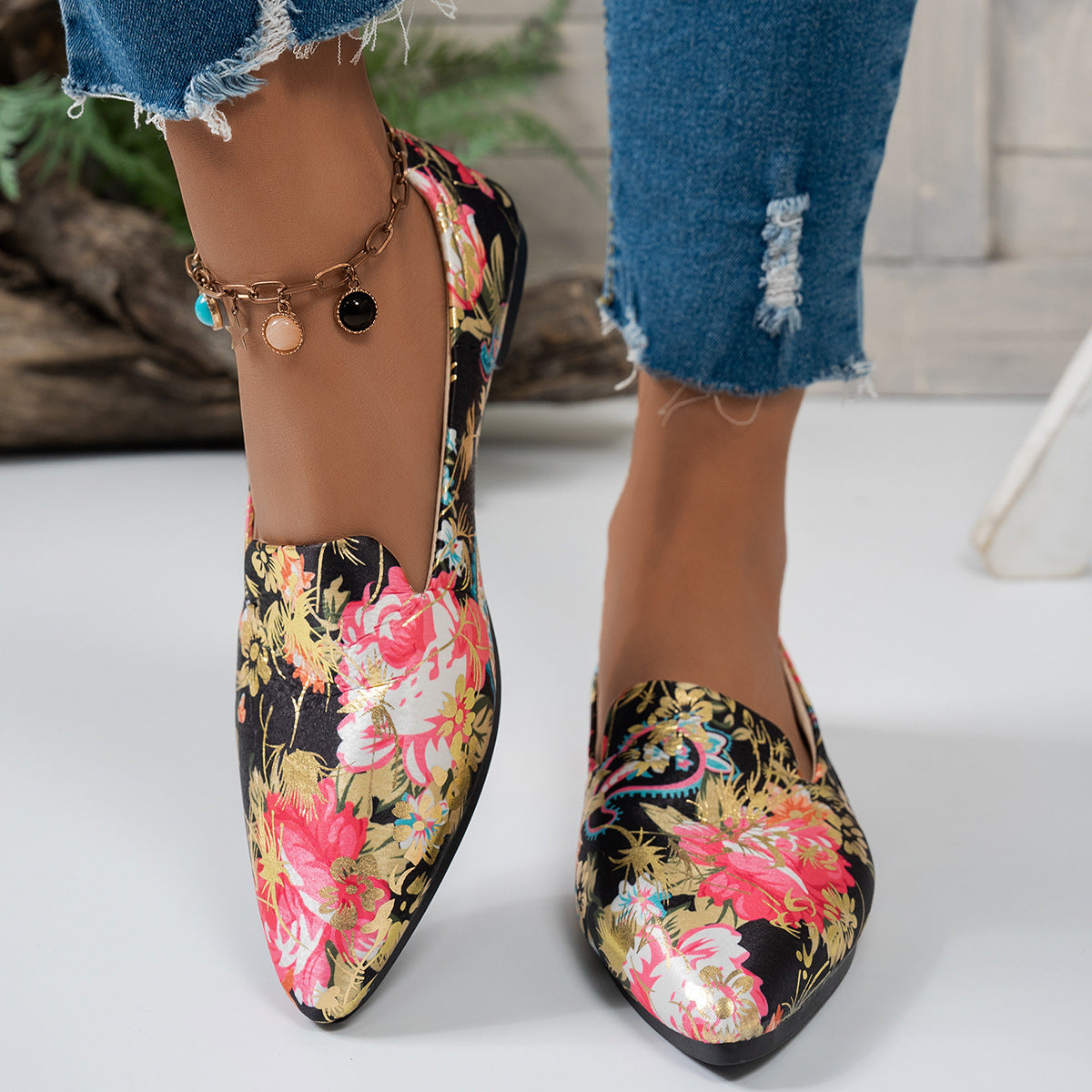 Women's flat pointed-toe shoes with floral design, perfect for casual everyday wear.
