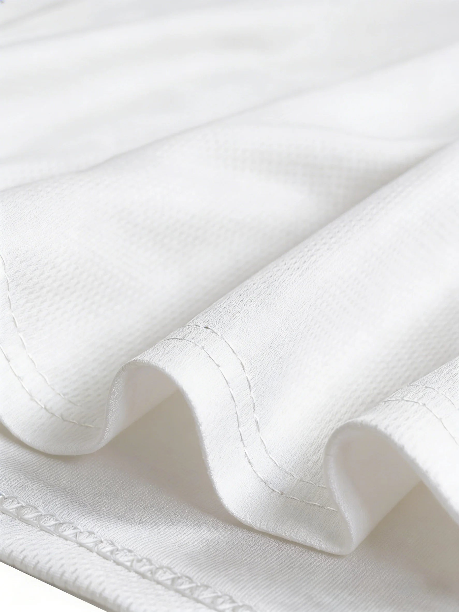 beer mug with men's vest on a beautiful white fabric background.