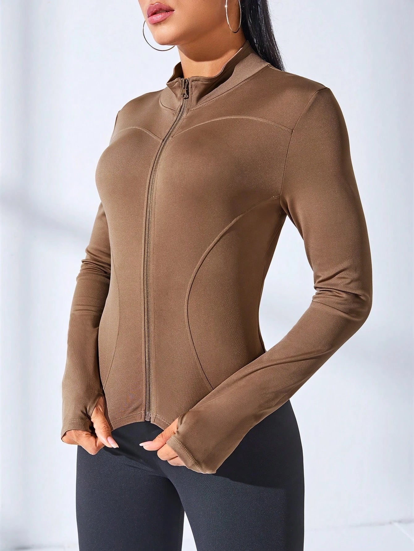 women's yoga coat with zipper shown in a sleek brown design, perfect for fitness and body sculpting.