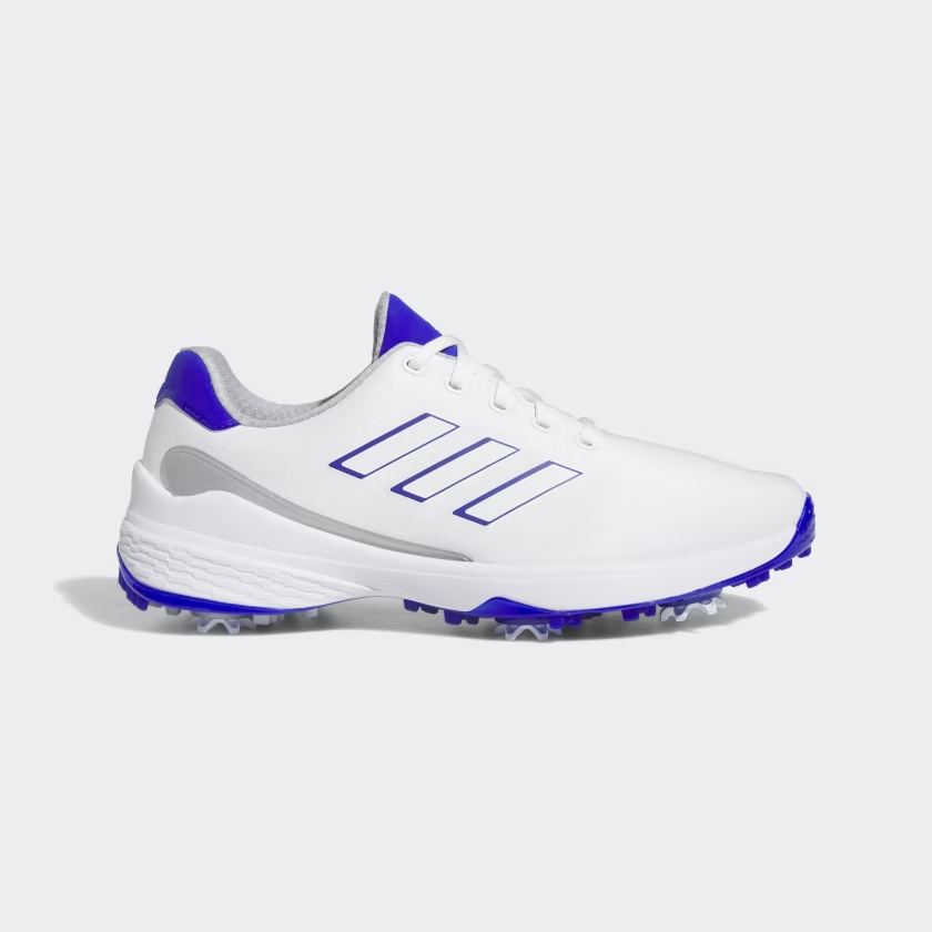 Adidas ZG23 golf shoes in white and purple, designed for ultralight performance on the golf course.