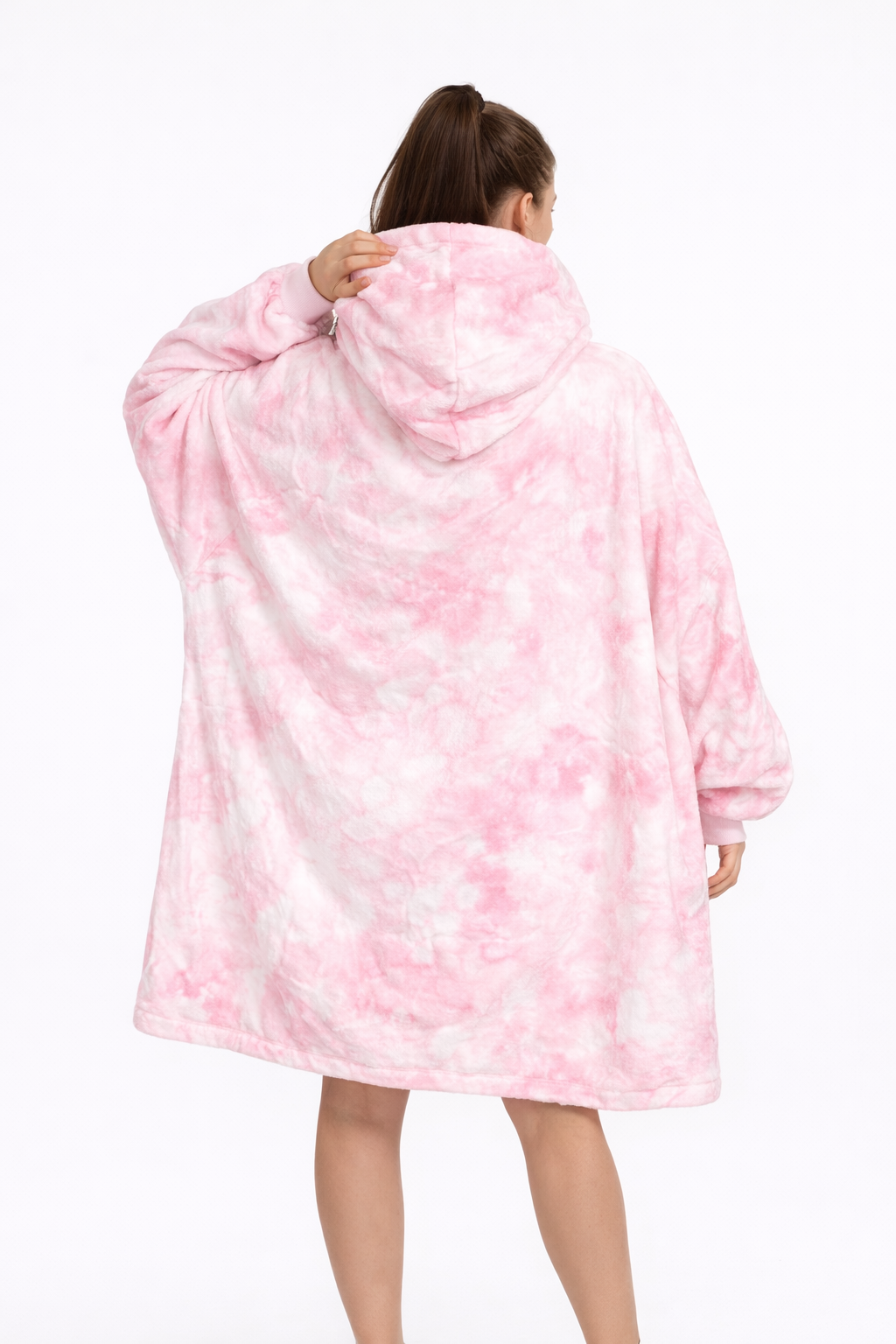 Back view of a person wearing a pink Nezuko Kamado blanket hoodie, showcasing its oversized design and soft fabric.