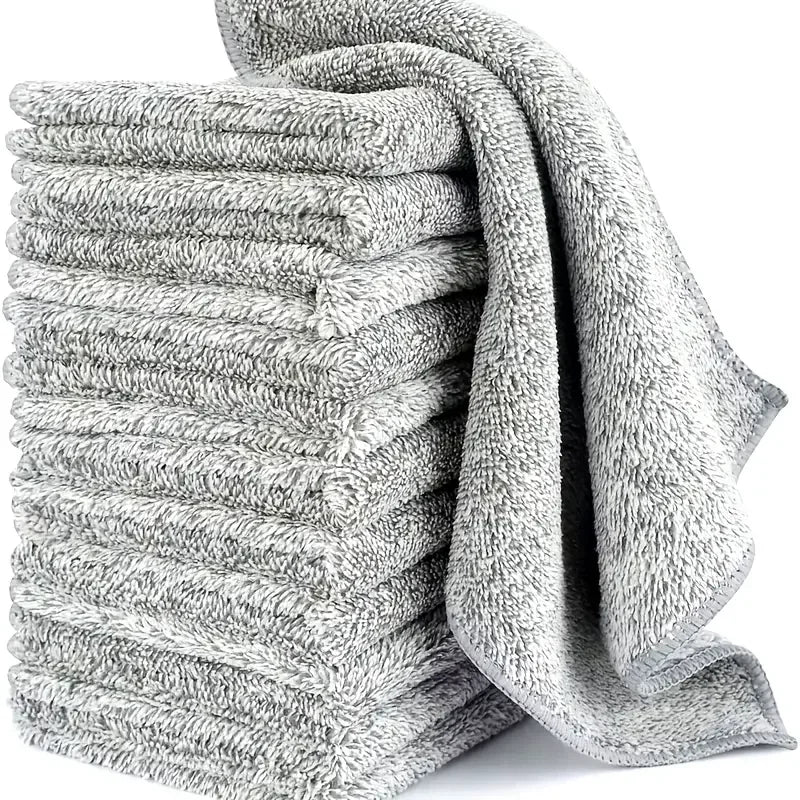 Stack of microfiber cleaning cloths in gray color, ideal for various cleaning tasks.