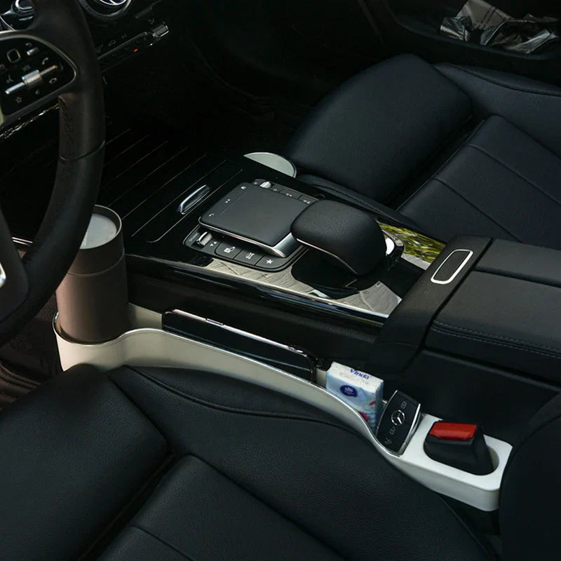 Car Seat Gap Filler Organizer in a modern vehicle interior, showcasing cup and phone holders for convenience.