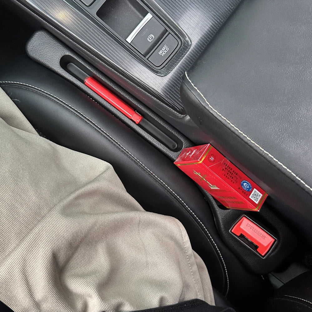 Car seat gap filler in a vehicle, preventing items from falling into the gap between seats and center console.