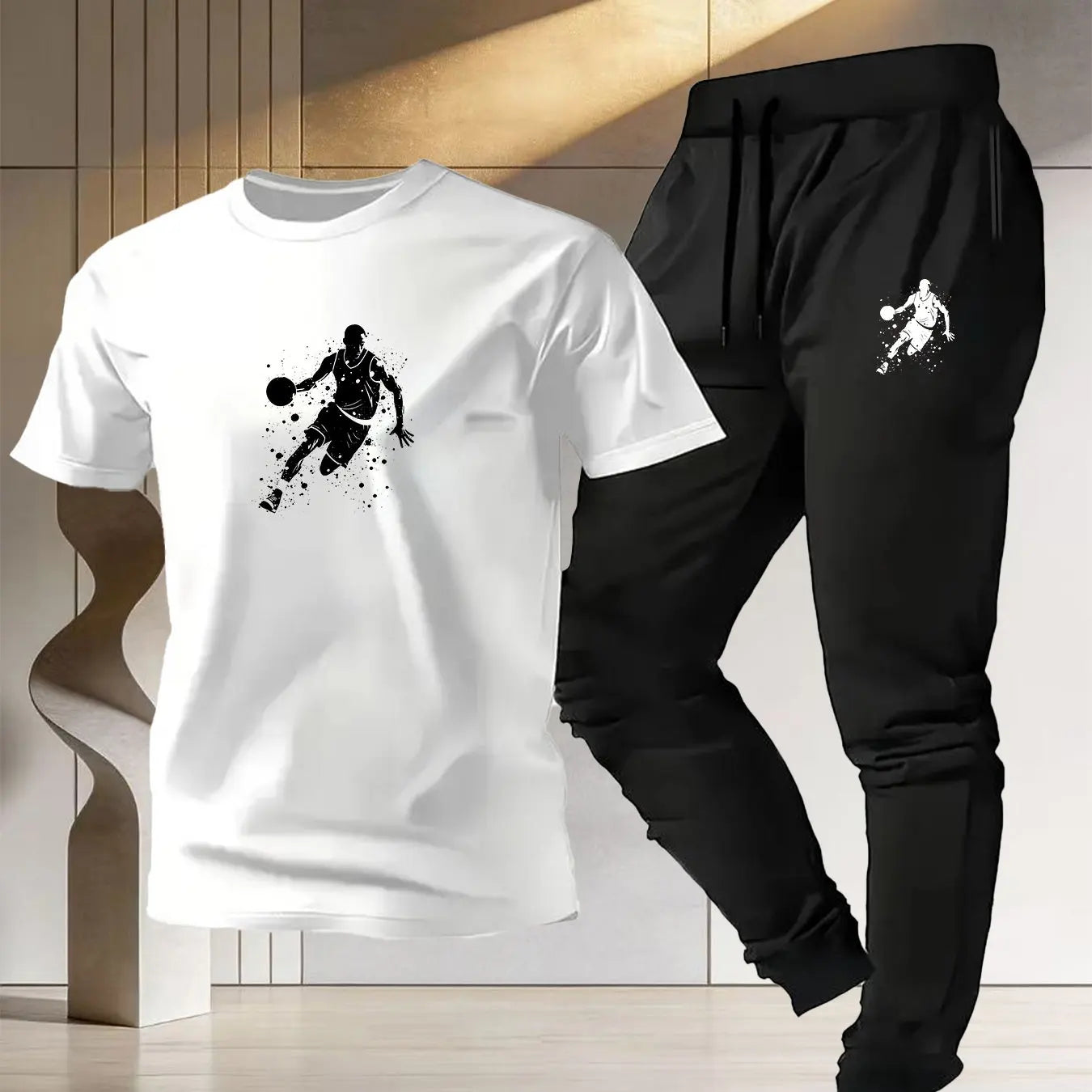 Men's basketball sportswear featuring a stylish white t-shirt and black joggers for athletic performance.
