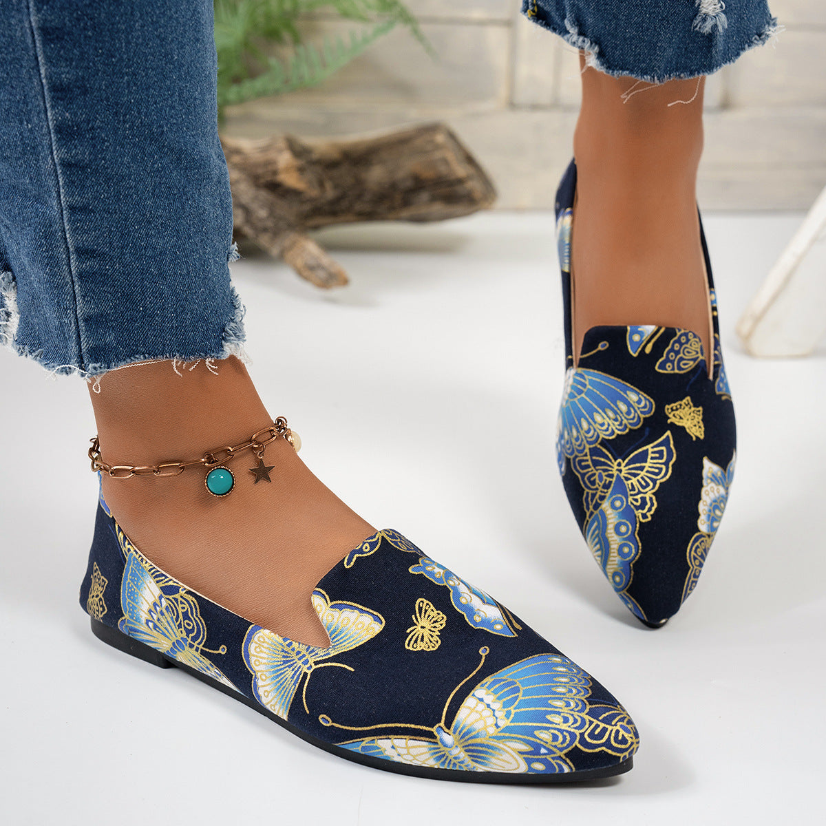 women's flat pointed-toe shoes in navy with butterfly print, perfect for casual everyday wear.