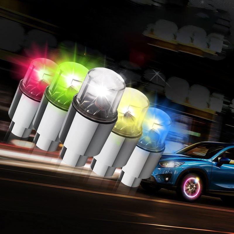 Colorful bicycle wheel LED lights enhancing visibility and safety at night.